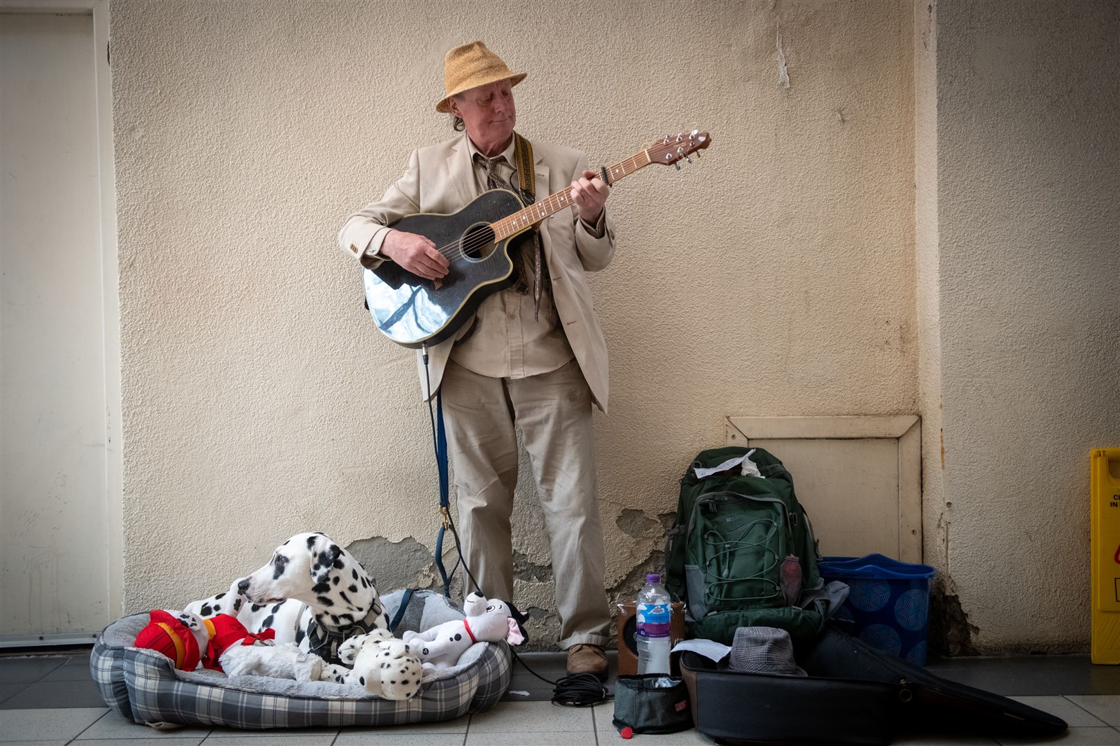 Inverness Busker John Casey and Moby the dog, in the Victorian Market. Picture: Callum Mackay..