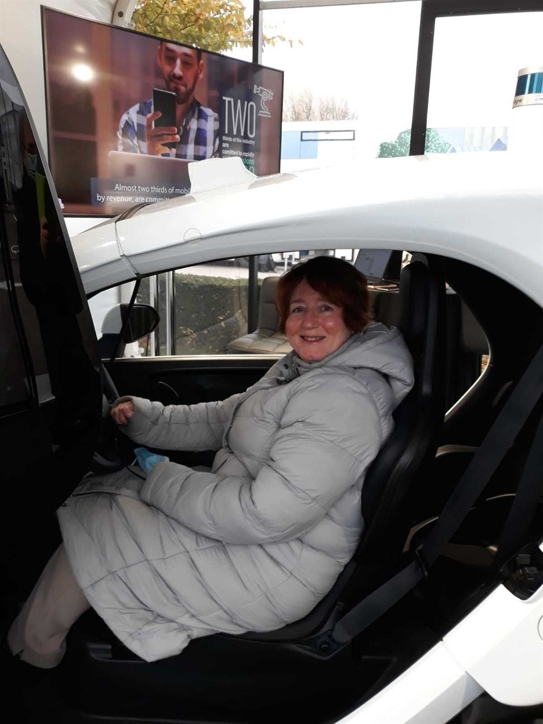 Cllr Angela Maclean sits in the autonomous vehicle on show at the COP26 green zone.