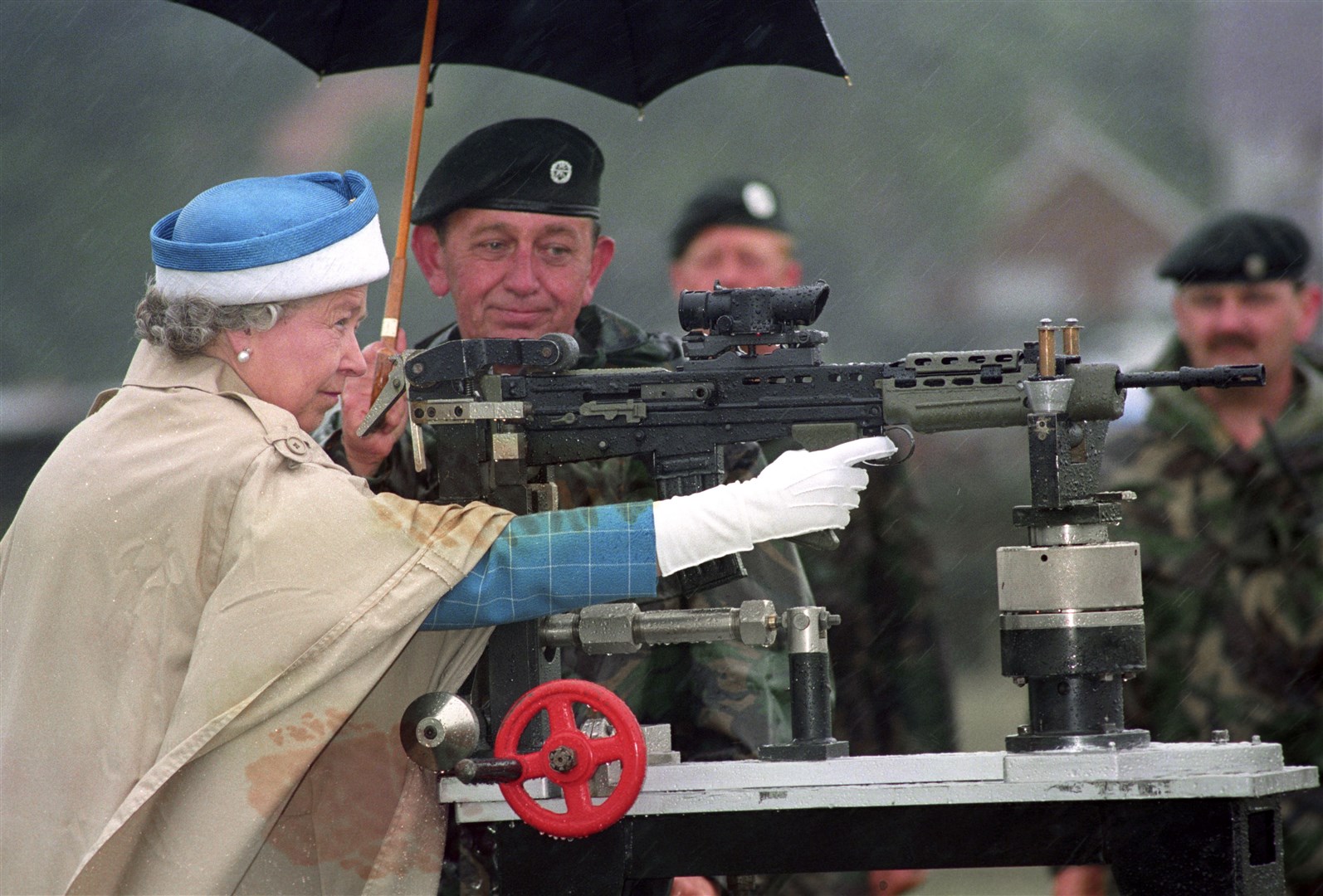 The Queen fires the last shot on a rifle at Bisley ranges (Tim Ockenden/PA)