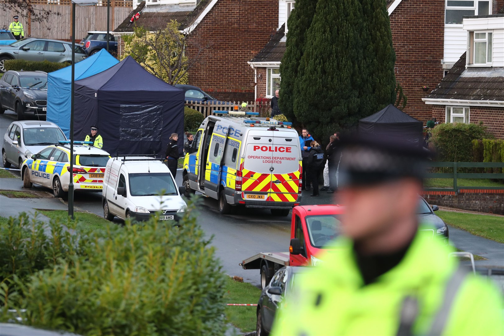Police at a scene in Hazel Way, Crawley Down, West Sussex, following the murders (Gareth Fuller/PA)