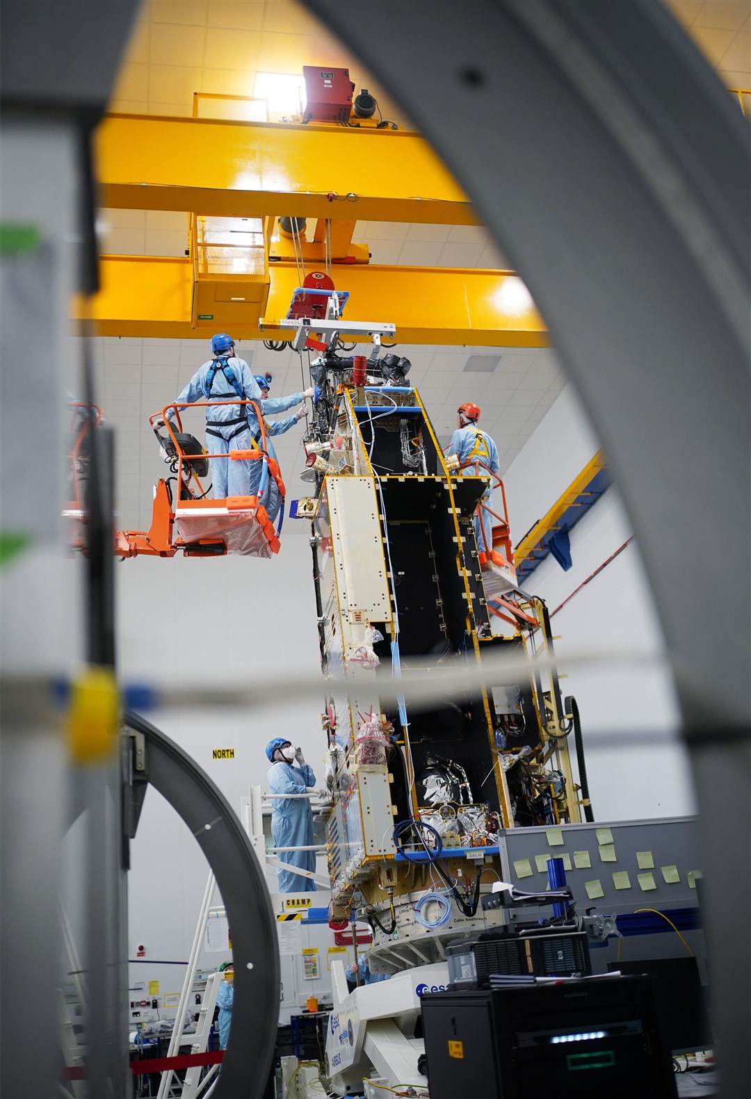 Members of staff work on the Biomass satellite at the Airbus factory in Stevenage, Hertfordshire (Yui Mok/PA)
