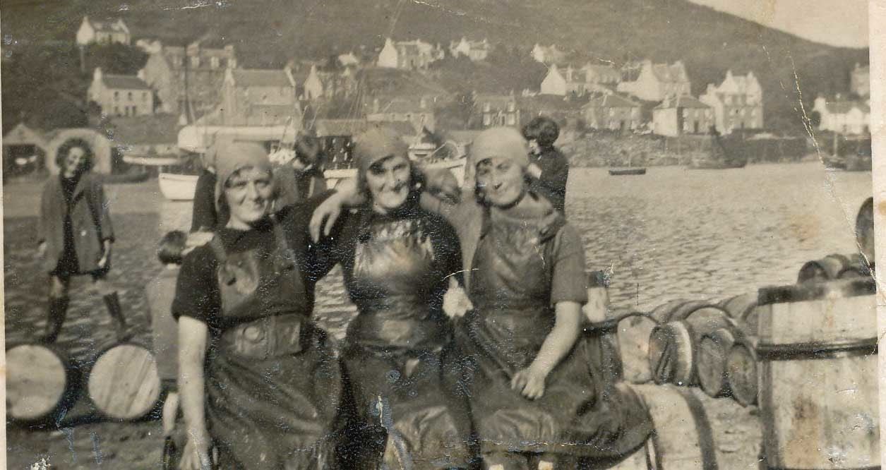 Three Avoch fisherwomen pose for a photograph in between sorting out the herring catch. Picture courtesy of Avoch Heritage Society.