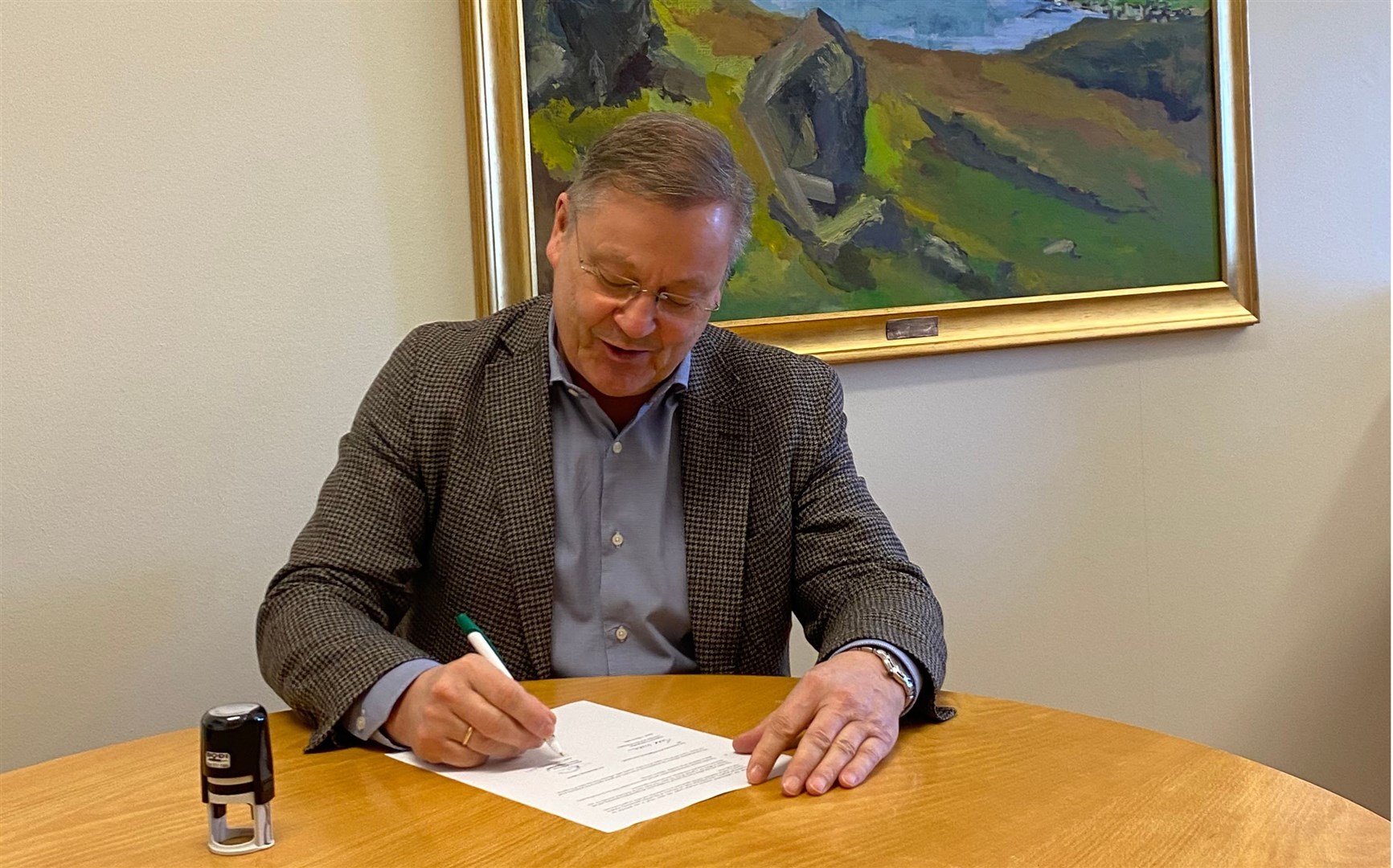 Björn Ingimarsson, mayor of Múlaþing signs on the dotted line.