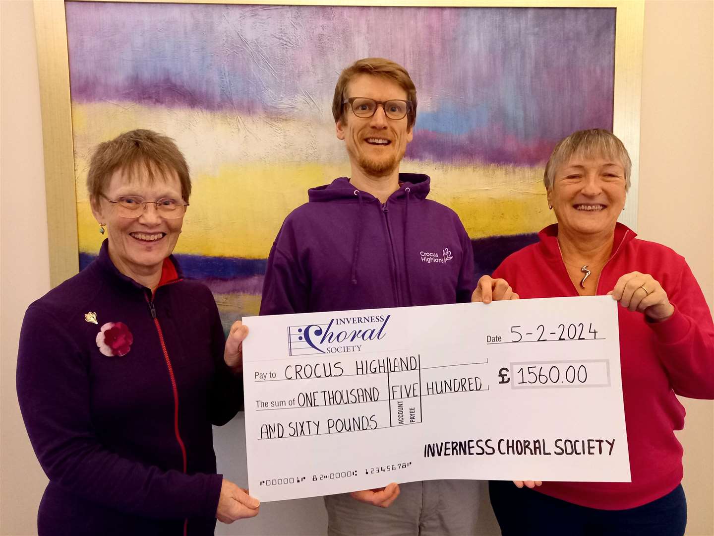 Craig Mitchell, of Crocus Highland, received a cheque for £1560 from Carol Brown, chairman of Inverness Choral Society, and Andrea Gritter, Carolthon organiser.