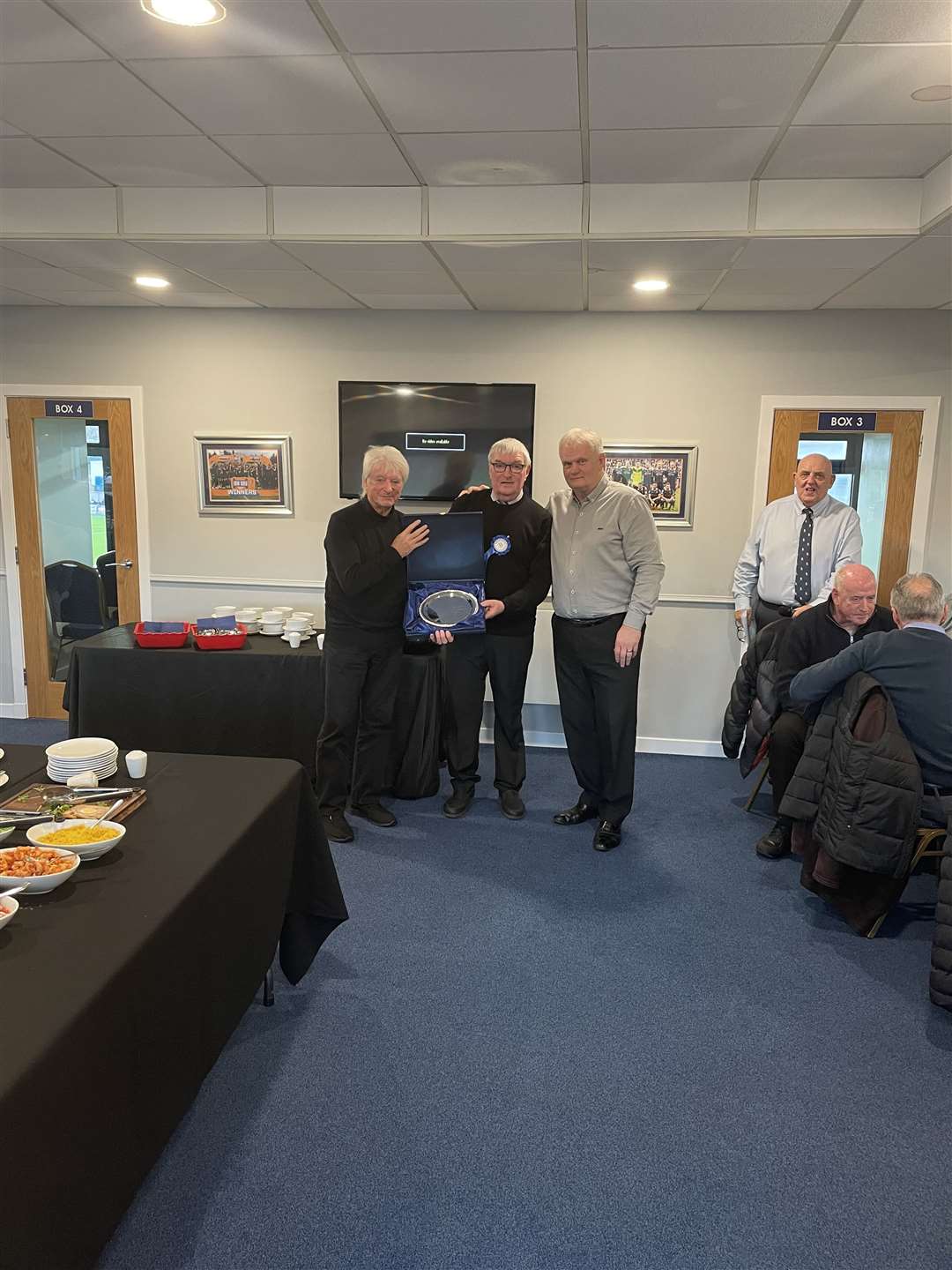Edwin Skinner receiving award from Jim Oliver and Willie Morgan.