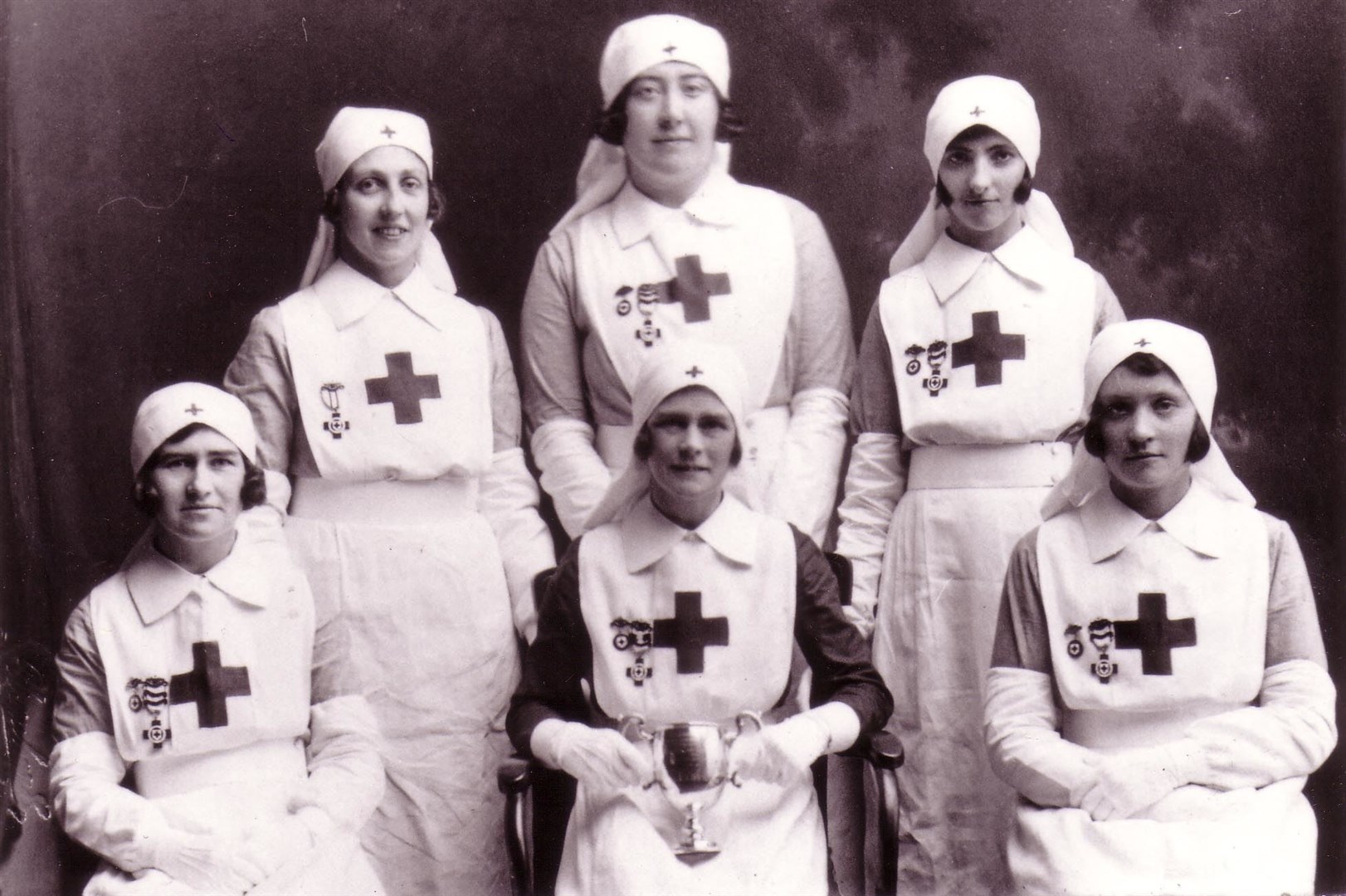Pictured are some Red Cross nurses who appear to have won a cup. This picture was taken in either 1932 or 1932 and in the back row are Miss Munro, West End PO, Helma McCallum and Betty Cameron and in front are Hetty Duff, Lizzie Duff and Lily MacRae (nee Grant). Picture courtesy of Dingwall Museum Trust/LEADER Project.