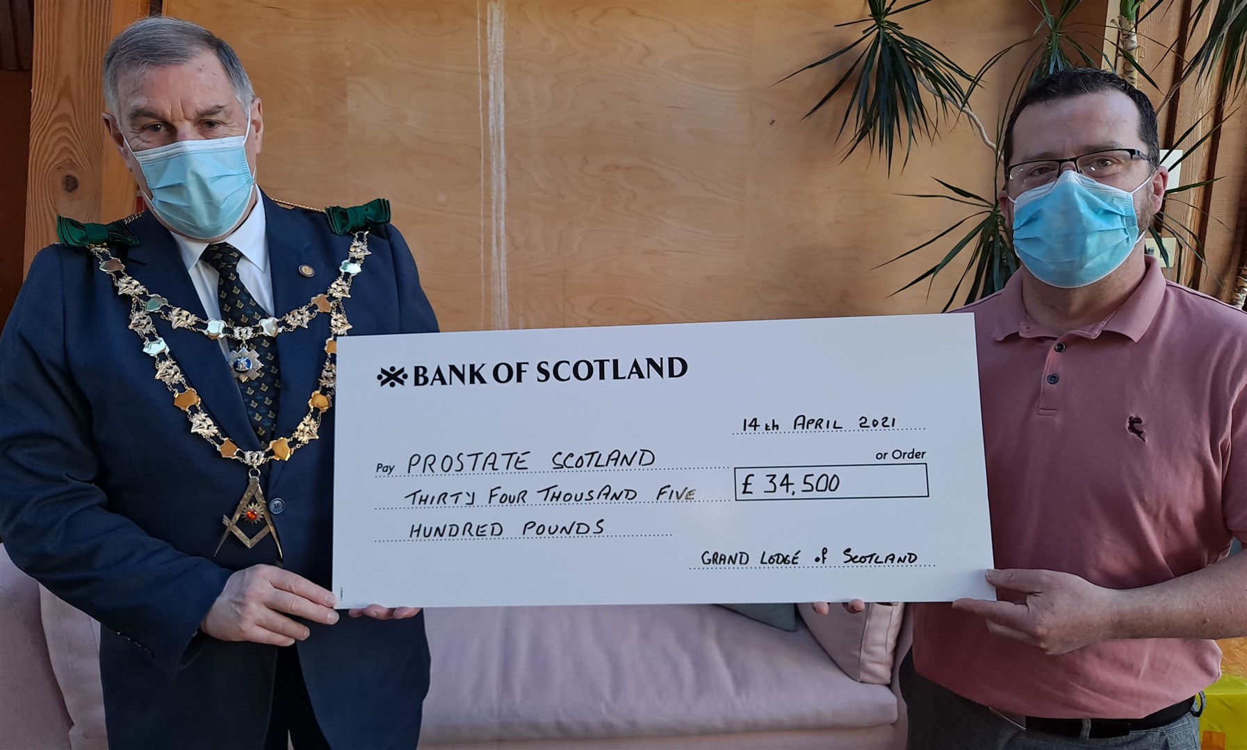 Ramsay McGhee presents a cheque for £34.500 to Brian Corr, a member of Prostate Scotland’s medical advisory committee and urology clinical nurse specialist at Raigmore Hospital.