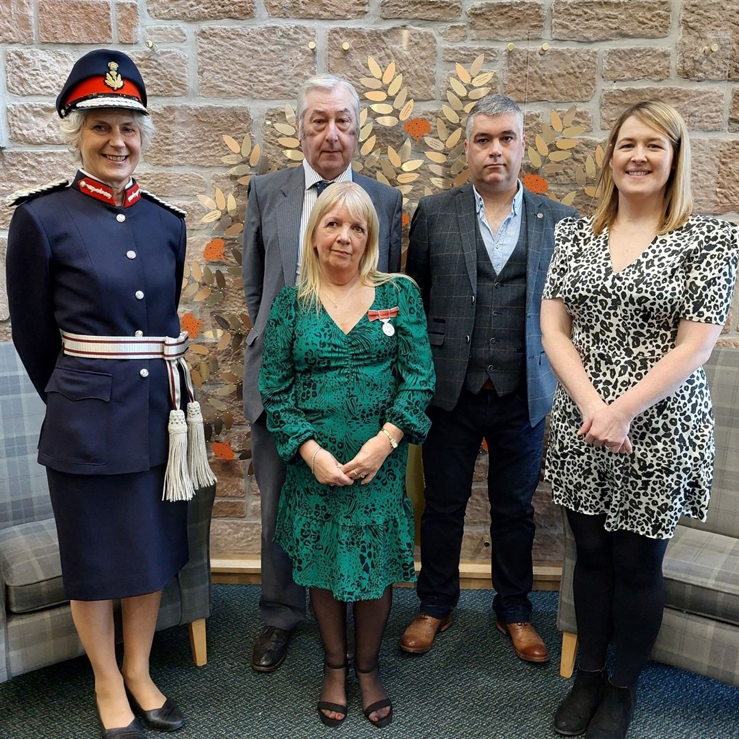 Pat Ross receives her British Empire Medal from Lord Lieutenant Joanie Whiteford.