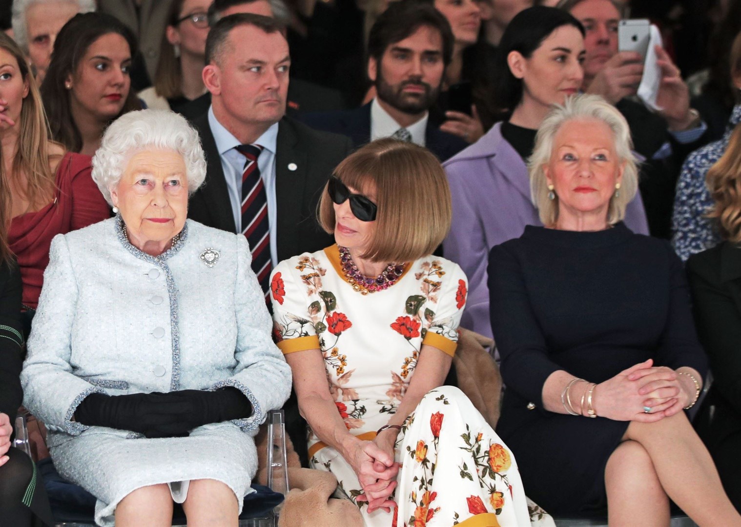 The Queen with Dame Anna Wintour and the monarch’s senior dresser and confidante Angela Kelly (right) (Yui Mok/PA)