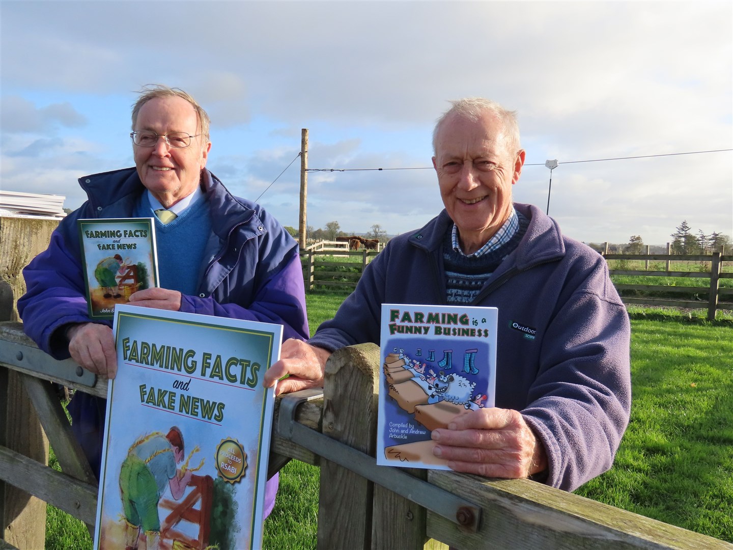 Andrew (left) and John Arbuckle pictured with one of the previous books, which have collectively raised over £72,000 for RSABI. It's hoped the new book will take that total to over £100,0000.