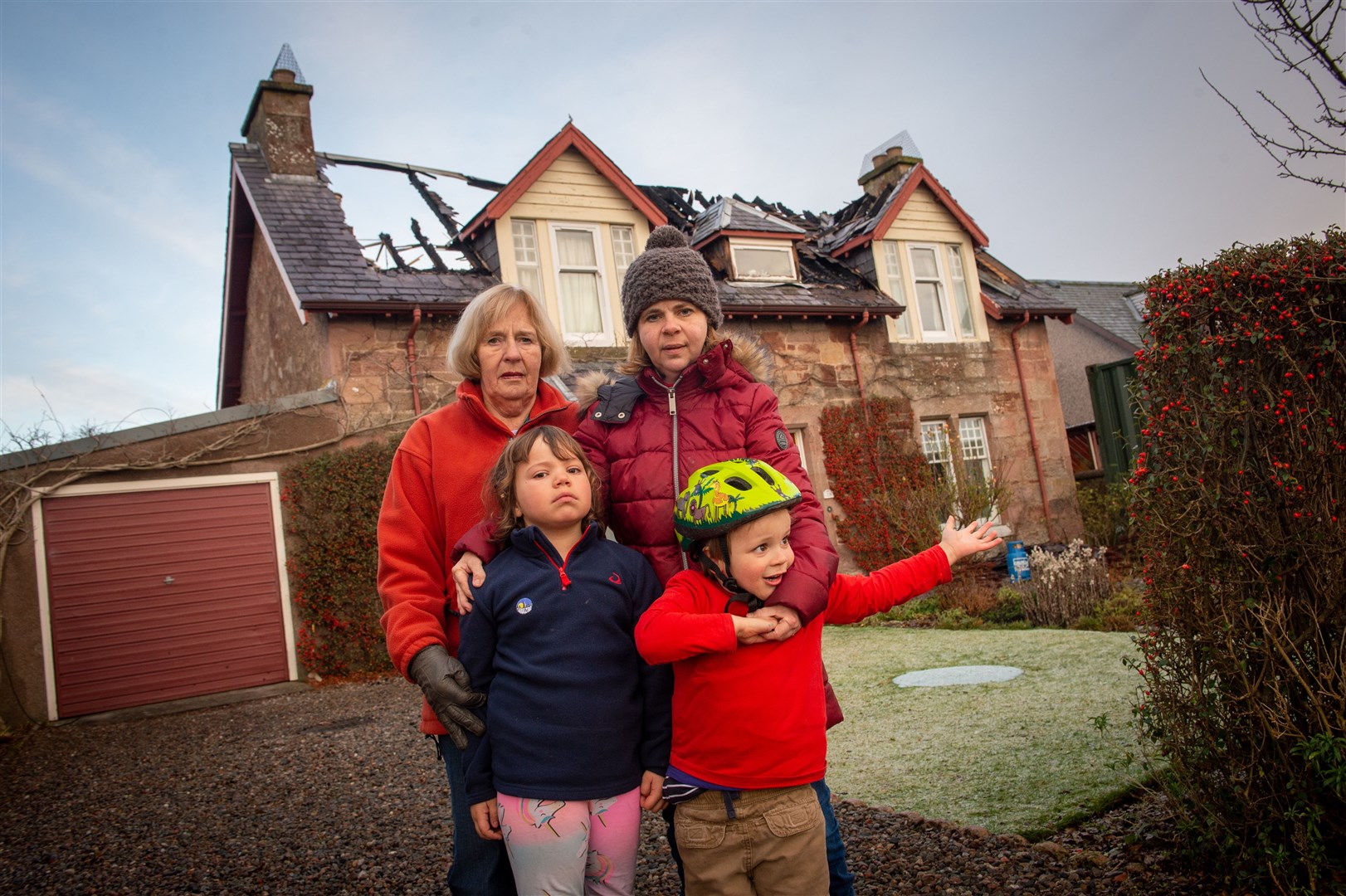 The aftermath of a devastating house fire in Castle Street, Fortrose.Lois MacDonell, Penelope MacDonell (rear) with (front) Vivienne DeJesus and Mark DeJesus. Picture: Callum Mackay
