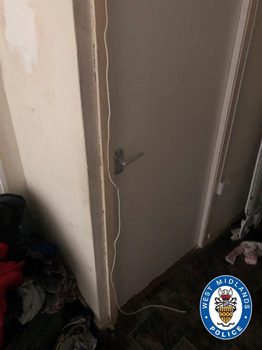 A length of wire was used to lock a bedroom door at the flat (West Midlands Police/PA)