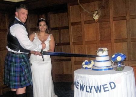 Luke Stoltman and bride Kushi cut the wedding cake in style!