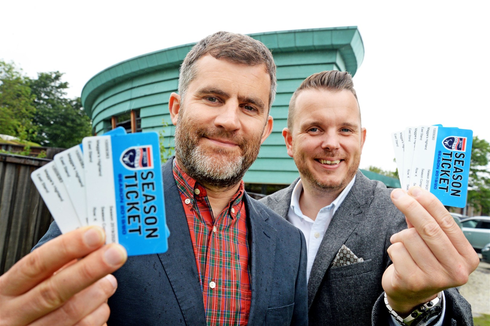 Andrew Ross (left), communications manager at Ross County FC with Andrew Benjamin, centre fundraising manager at Maggie's, holding the season tickets. Picture: Gair Fraser. Image No. 044091