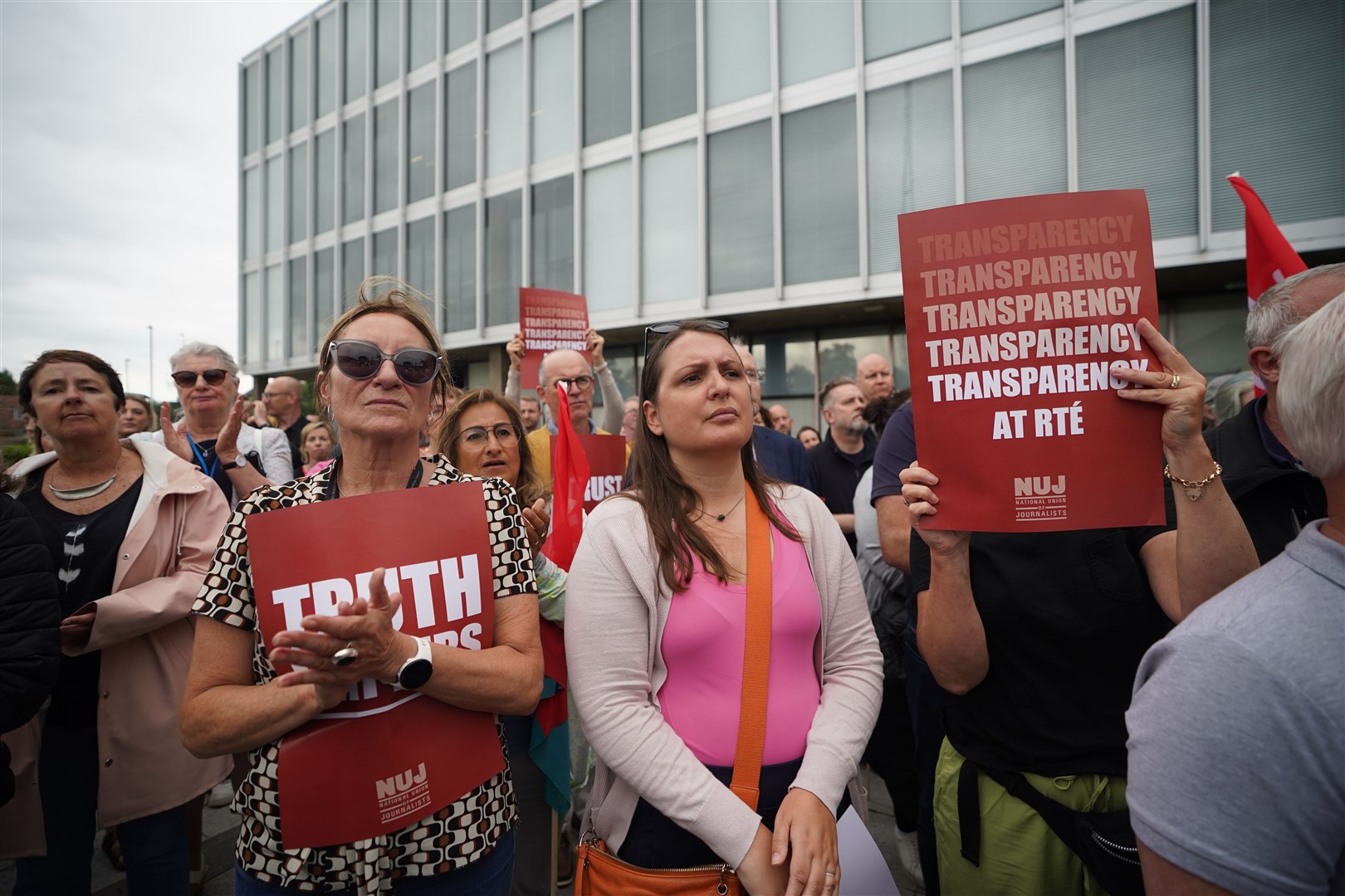 Members of staff from RTE take part in a protest at the broadcaster’s headquarters in Donnybrook (PA/Niall Carson)