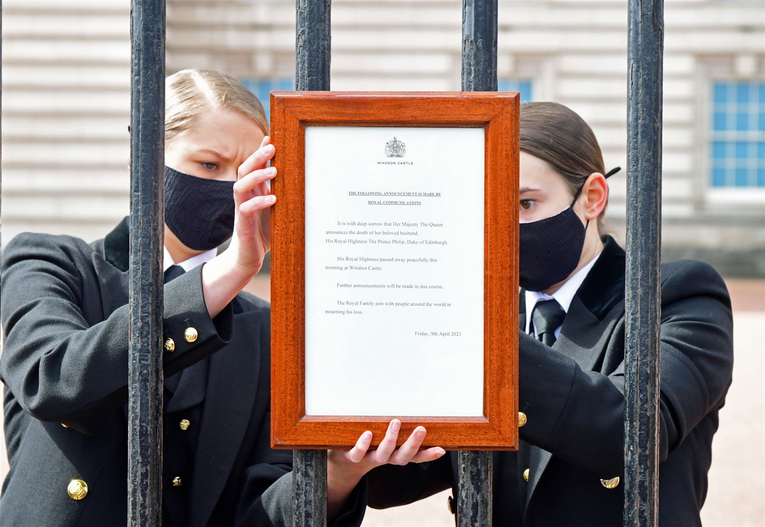 A notice announcing Philip’s death was placed on the front gates of Buckingham Palace (Ian West/PA)