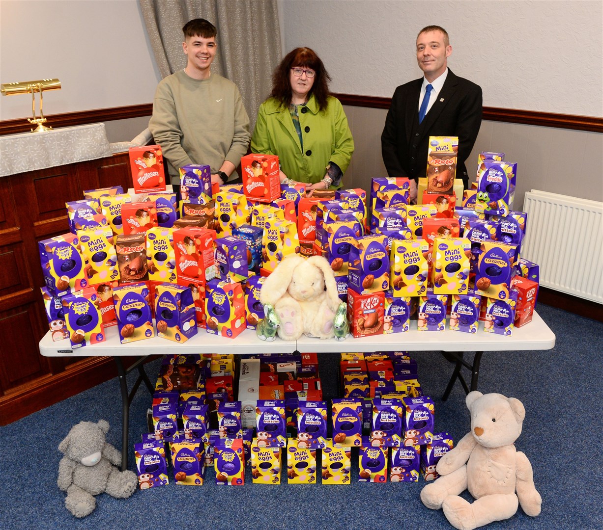 D. Gunn Funeral Home Dingwall Easter egg appeal..Gary Clark(left) of Funeral Home with 195 eggs which will give 3 locally charities 65 each,collecting there share are Janette Douglas and Josh Hutchison from The Place Alness. Picture Gary Anthony