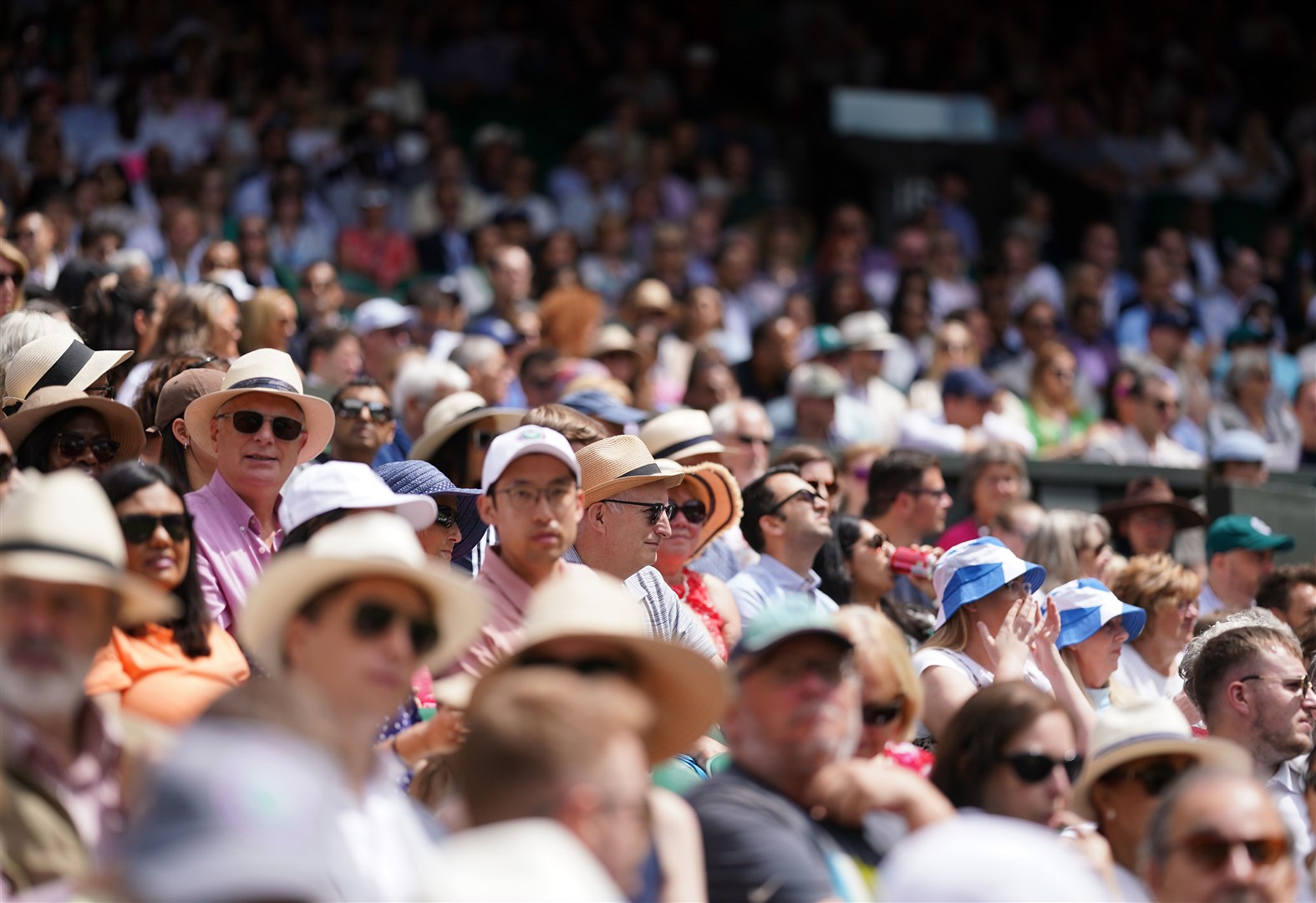 Spectators on centre court on day seven of the 2023 Wimbledon Championships (PA)