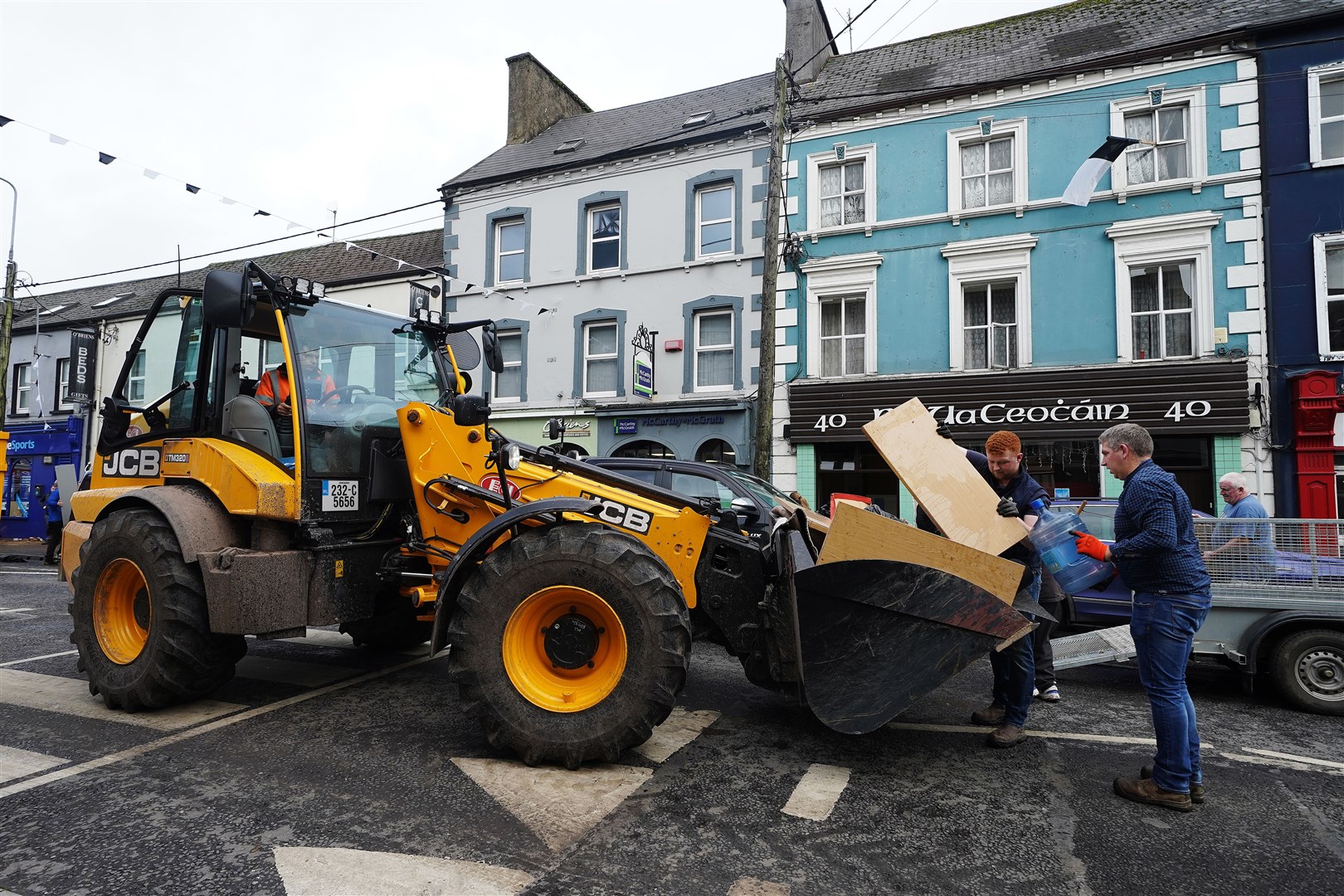 The clean-up gets under way on Main street in Midleton (Brian Lawless/PA)