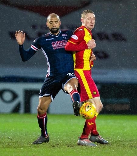 Liam Fontaine clears from Partick Thistle's Chris Erskine