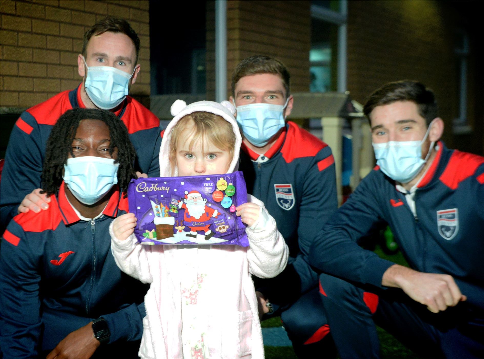 Ali gets a picture taken with Keith Watson, Joseph Hungbo, Ross Callachan and Jack Baldwin from Ross County FC during their visit to the Highland Children's Unit. Picture: James Mackenzie