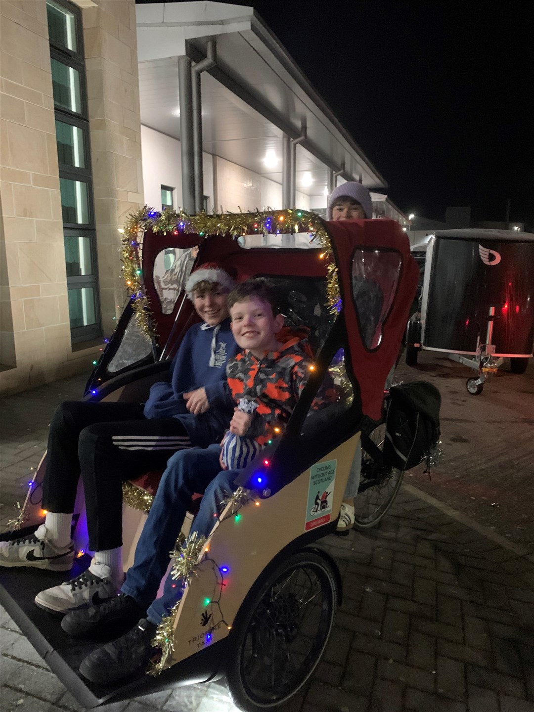 Senior pupils got involved in offering 'sleigh' rides outside - on the community trishaw.