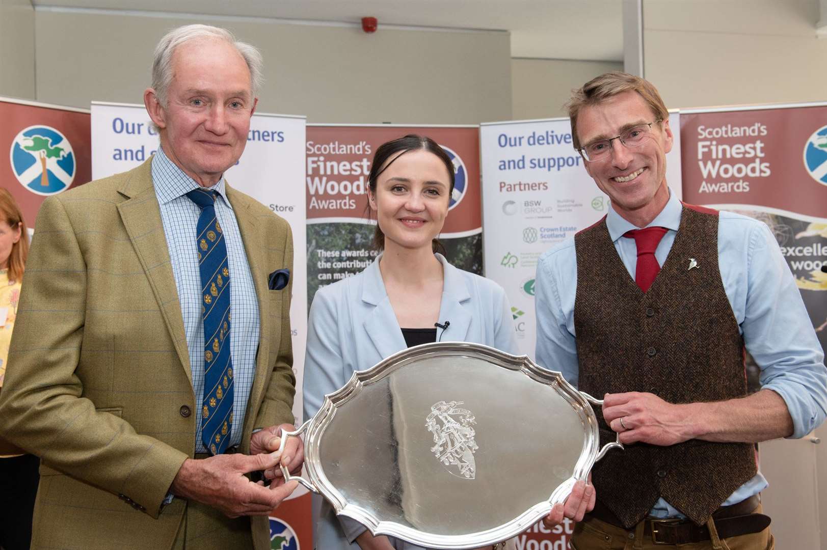 Co-winners of the Farm Woodland Award and Lilburn Trophy - Michael Clarke, Williamwood (l) & Richard Lockett, Knockbain (r) with Màiri McAllan, Minister for the Environment and Land Reform.  SFWA 2. Photo by: Julie Broadfoot