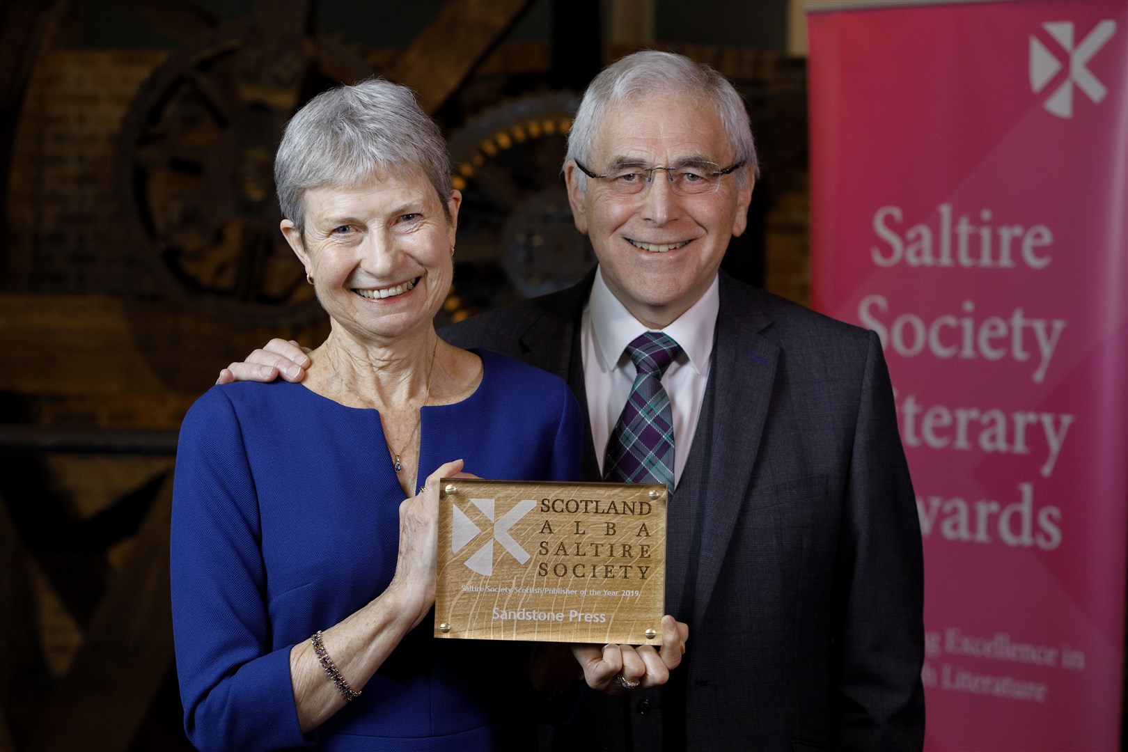 Bob and Moira accepting The Saltire Society Scottish Publisher of the Year award. Picture: Graham Clark