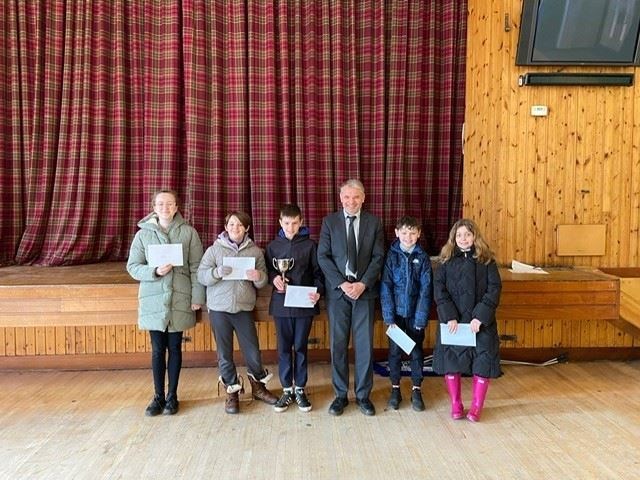 The winning children being presented with their prizes by Mark Jones, head teacher at Tain Royal Academy.