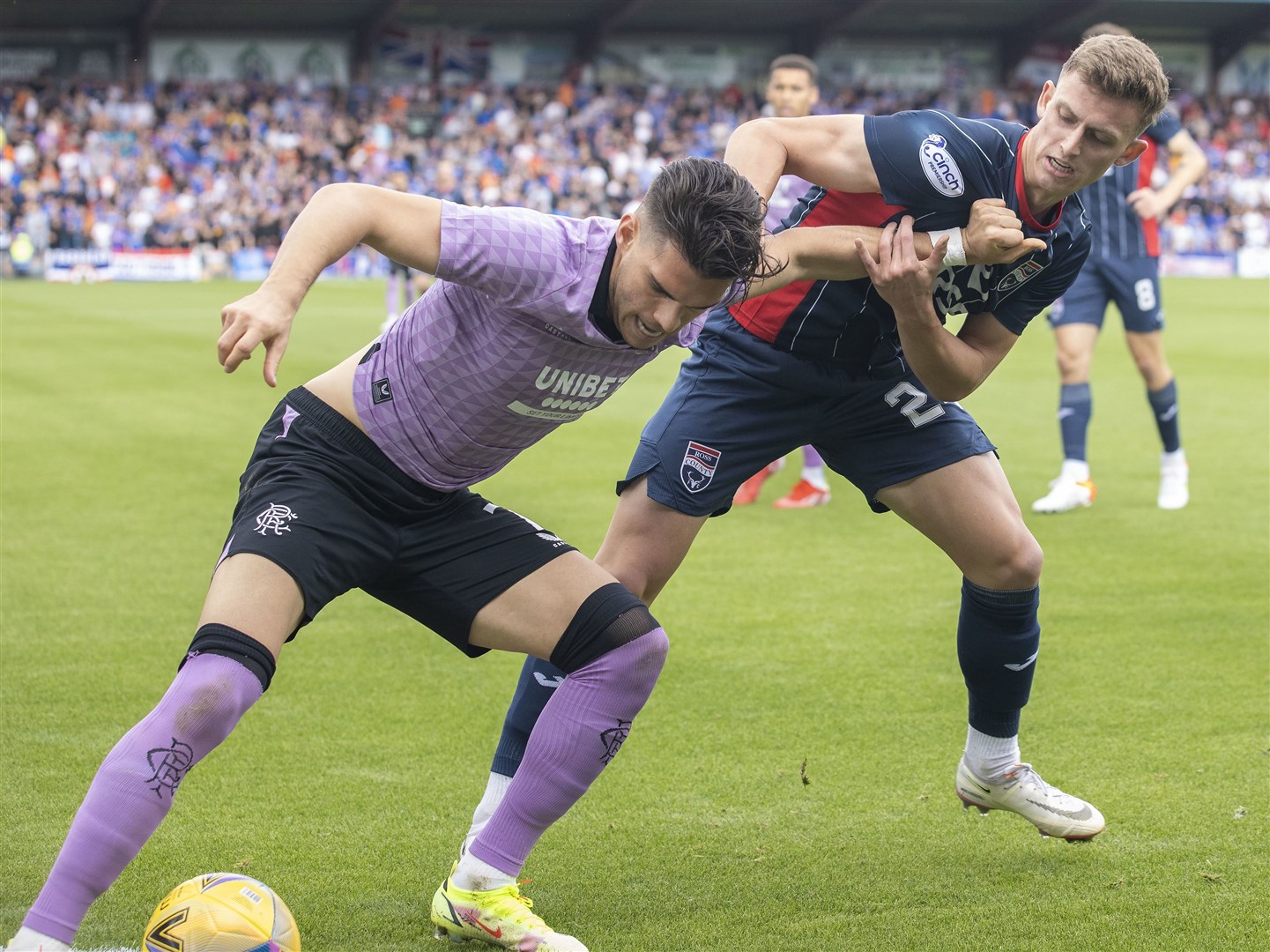 Picture - Ken Macpherson, Inverness. Ross County(2) v Rangers(4). 22.08.21. Ross County's Ben Paton in an early tussle for the ball with Rangers' Ianis Hagi.