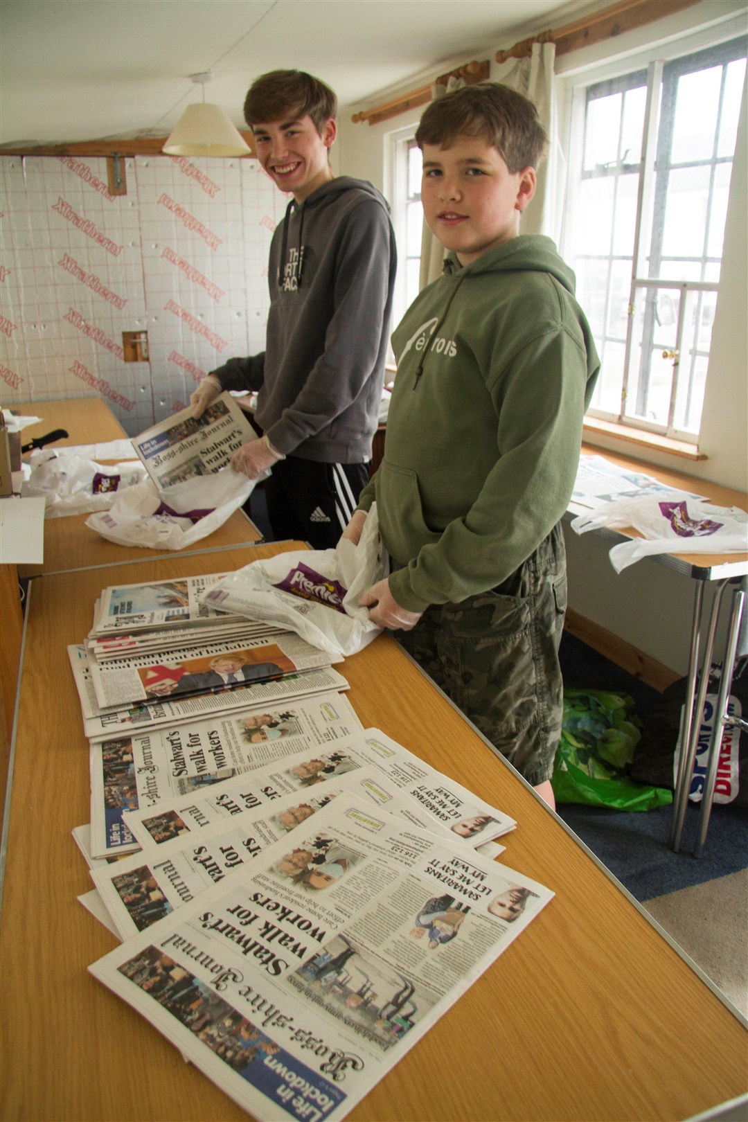Brothers Gregor and Alastair Fox get the papers' order sorted out.