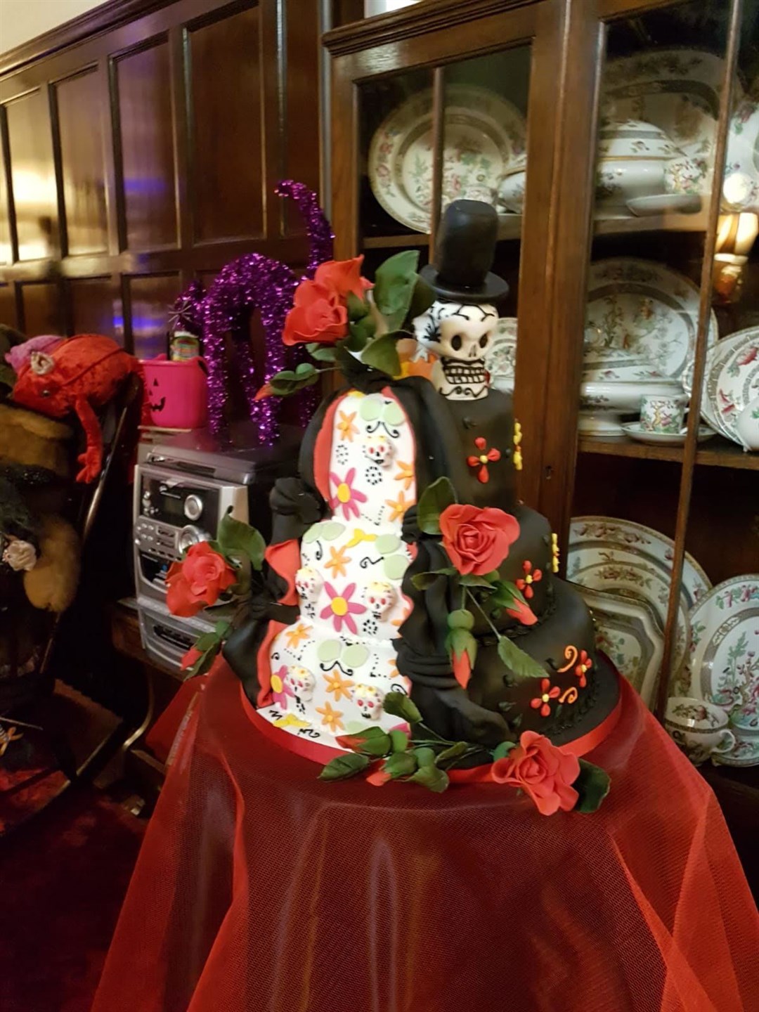 The amazing Day of the Dead cake, made by one of Gaye’s colleagues, was adorned with sugar skulls and roses.
