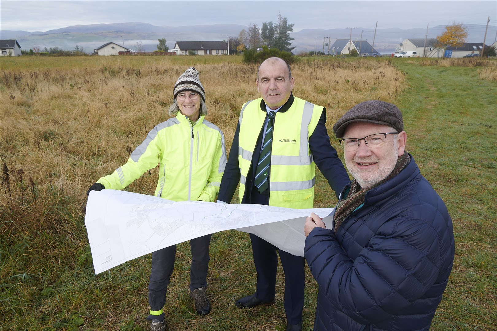 Pictured at the site are Jenny Edwards, director of Culbokie Community Trust, Billy McKay, Tulloch Homes construction director and Richard Fyfe, Trust chairman.
