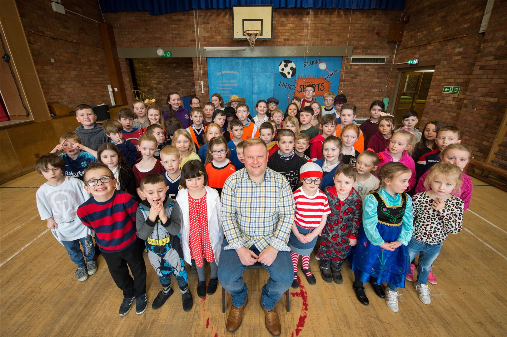 Muir of Ord author Colin McAndrew at Tarradale Primary for World Book Day...Muir of Ord author Colin McAndrew with some of the children.. .Picture: Callum Mackay. Image No. 043384.