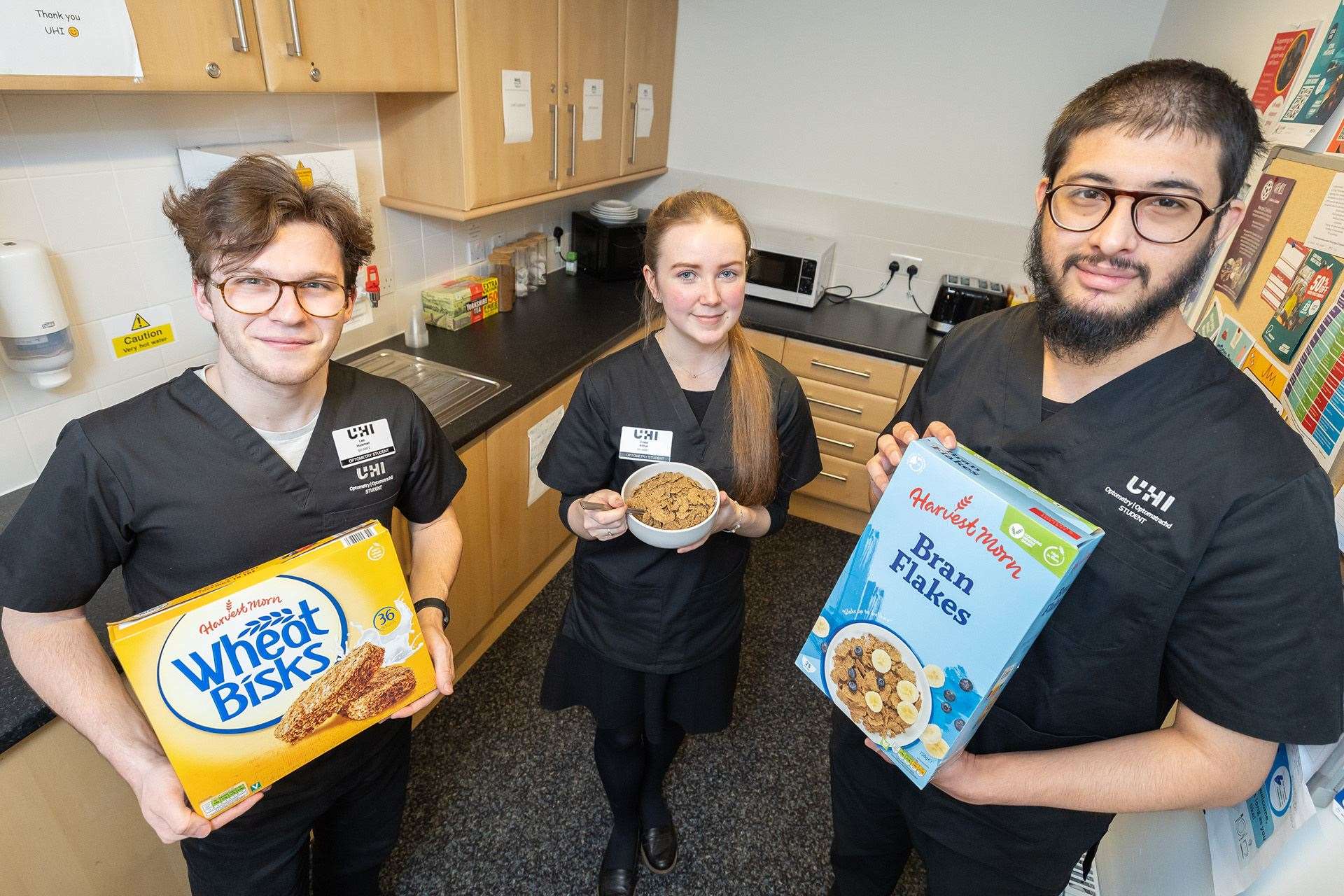 Optometry students Leo Huisman, Crista Arthur and Suad Badshah with breakfast supplies in the student kitchen at UHI House. Picture: Paul Campbell.