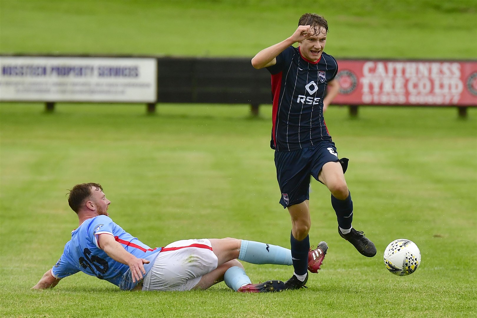 Ross County under 18s' Jamie Williamson avoids challenge from Wick's Rob McLean. Picture: Ken Macpherson