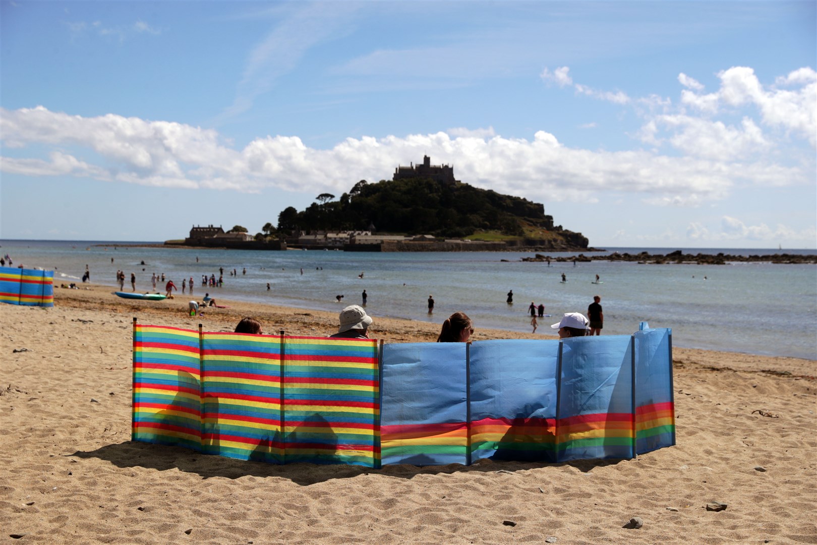 Places like Marazion and Saint Michael’s Mount in Cornwall are proving popular with holidaymakers (David Davies/PA)