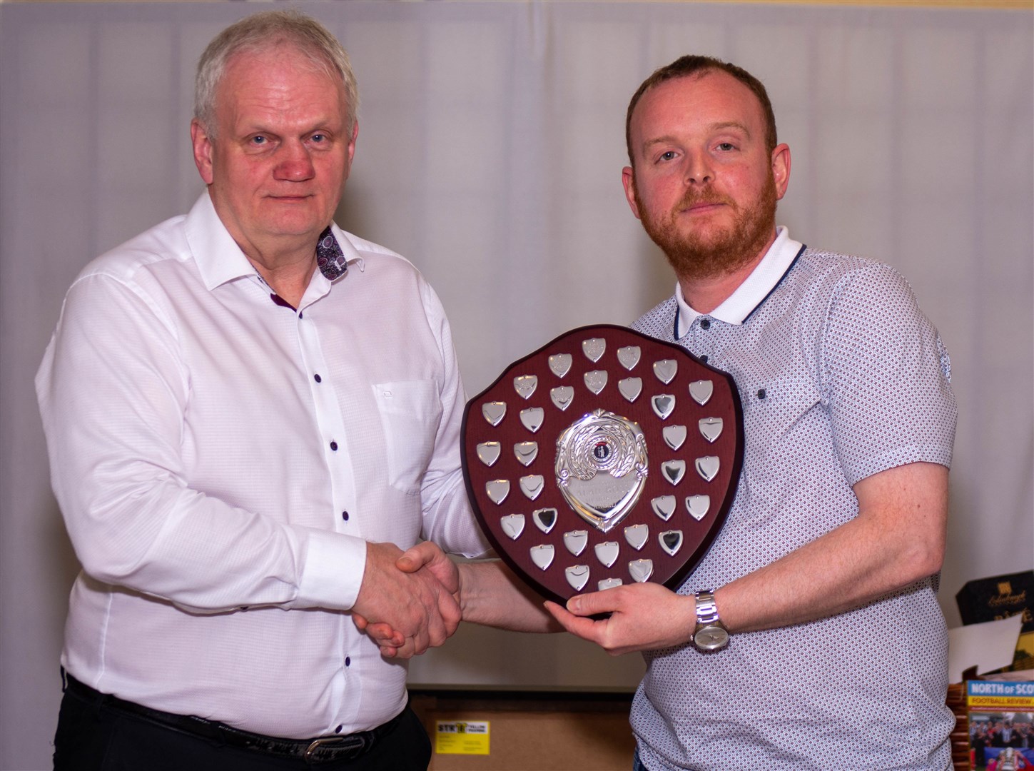 Guest speaker James Oliver and Stuart Ross, with the new Alan Ross Memorial Shield. Photo: George Reid