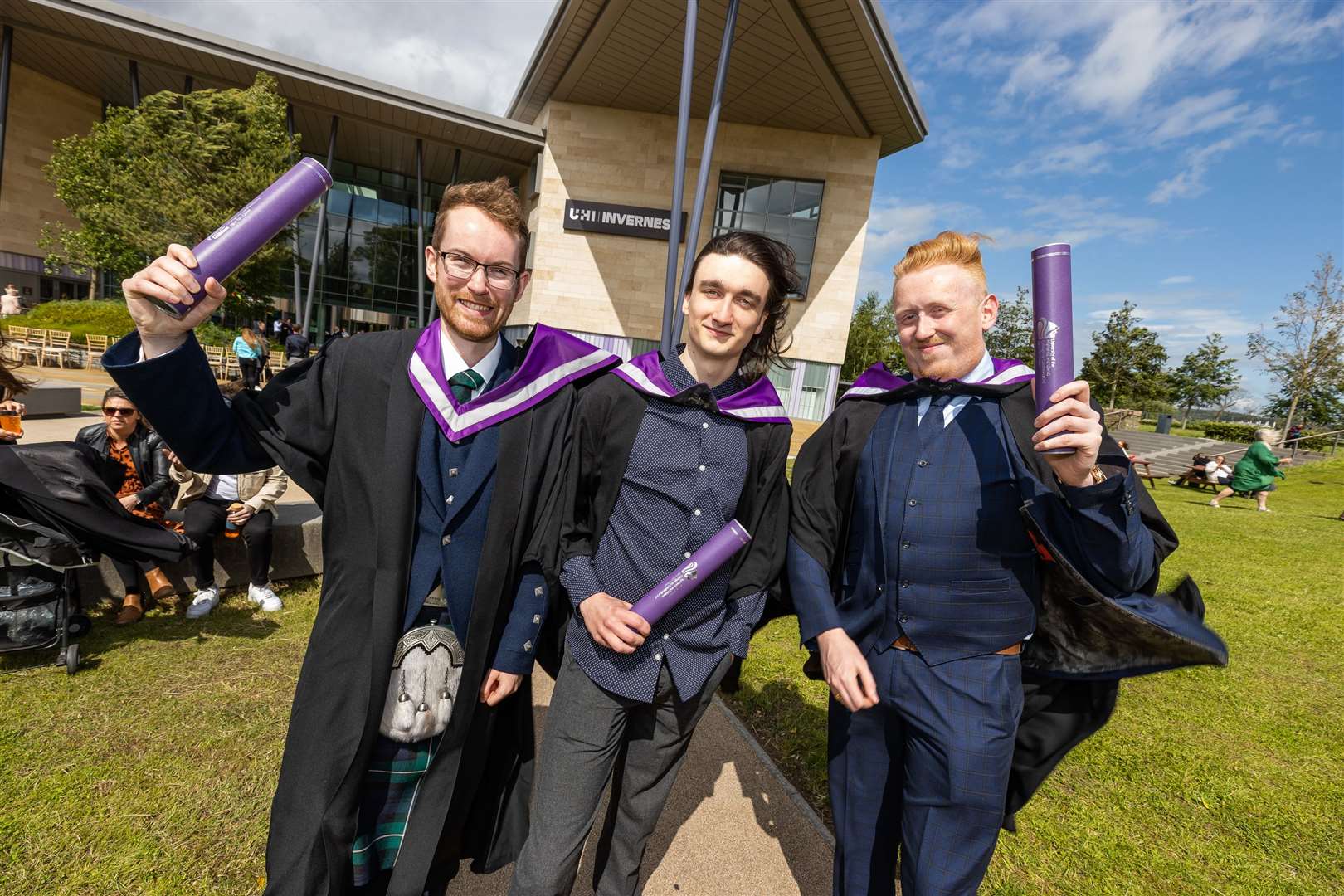 Architectural technology honours degree graduates Calum McNeill, Marcel Ulas and Jamey Campbell reunite to celebrate.