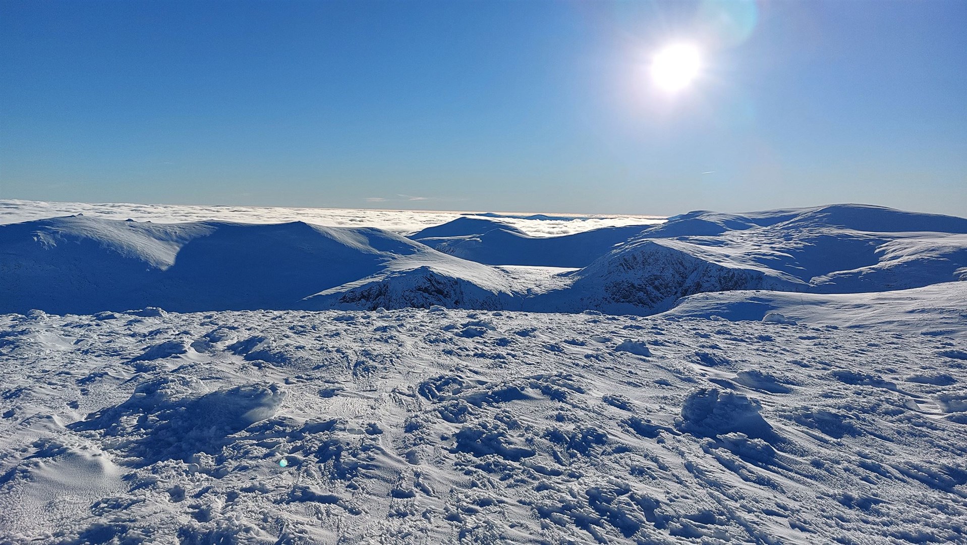 From Cairn Gorm summit looking south towards Loch Etchachan with Ben Macdui on the right and Beinn Mheadhoin on the left. The walker got lost in very different conditions.