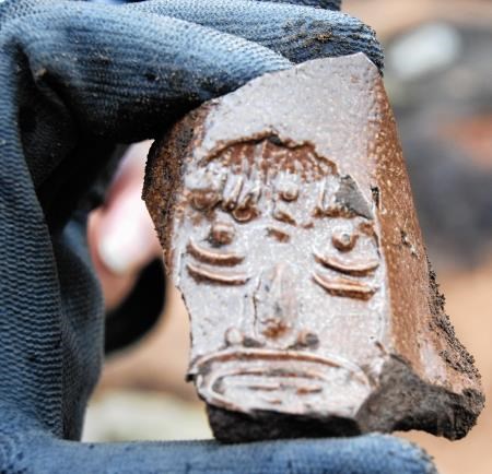 A face mask on a fragment of an imported Bellamine jug which was dug up at the site.