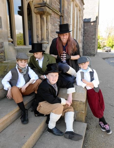 Dan Corr (front, centre) from Alness with other members of the cast of Oliver.
