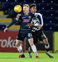 Ross County's Billy Mckay is challenged by ICT's Collin Seedorf.
