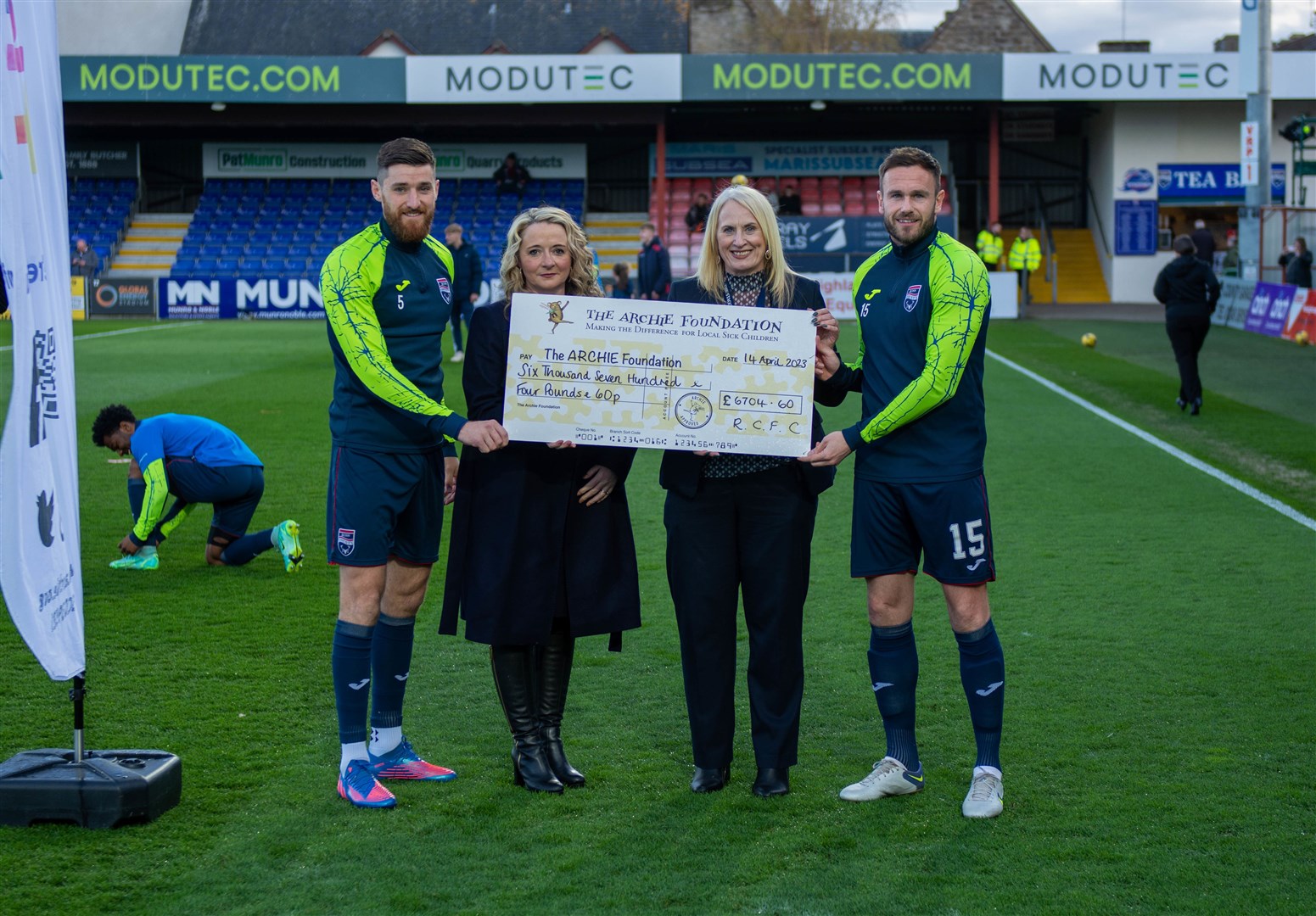 Cheque out this boost! Jack Baldwin (from left), Mary Nimmo representing the Archie Foundation, Lorraine Christie of Ross County FC and Keith Watson.