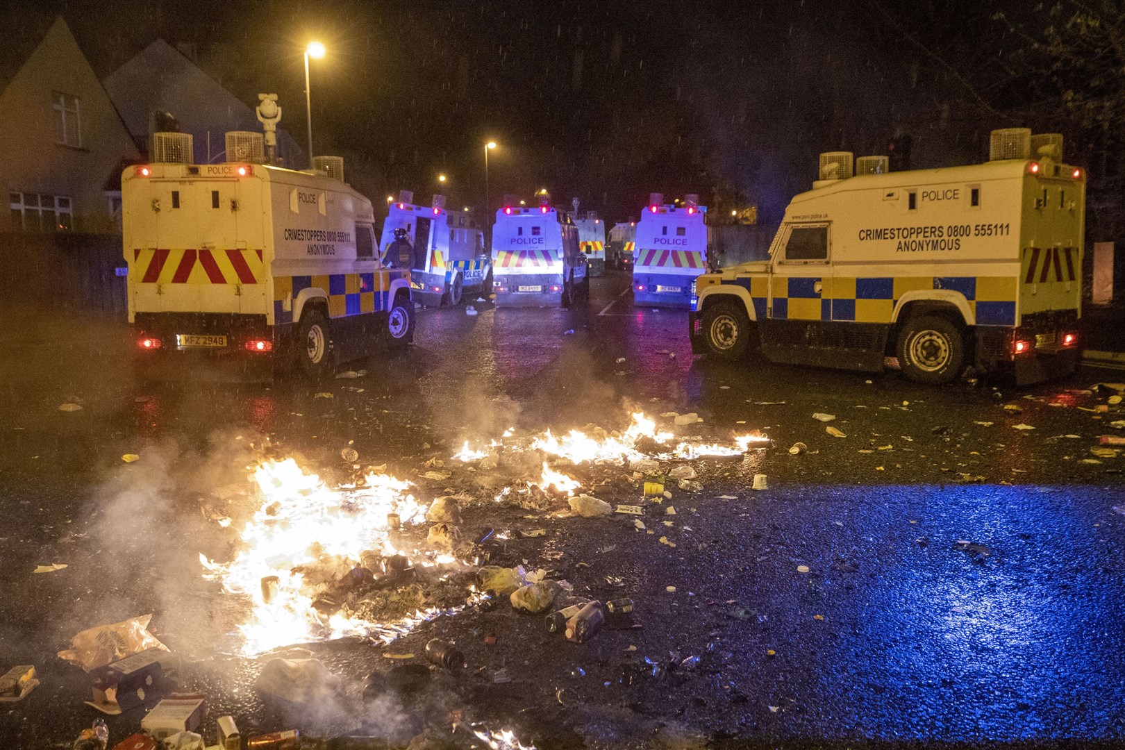 PSNI Tactical Support Group officers at the loyalist Nelson Drive Estate (Liam McBurney/PA)