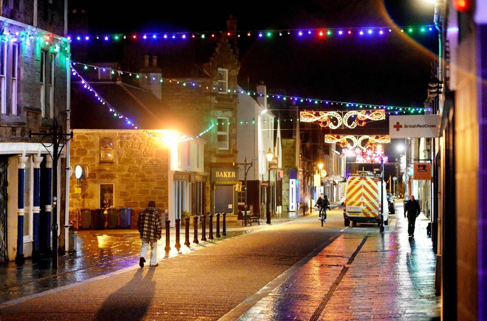 Dingwall High Street's festive lights reflect the hope of better times ahead. Picture: James Mackenzie