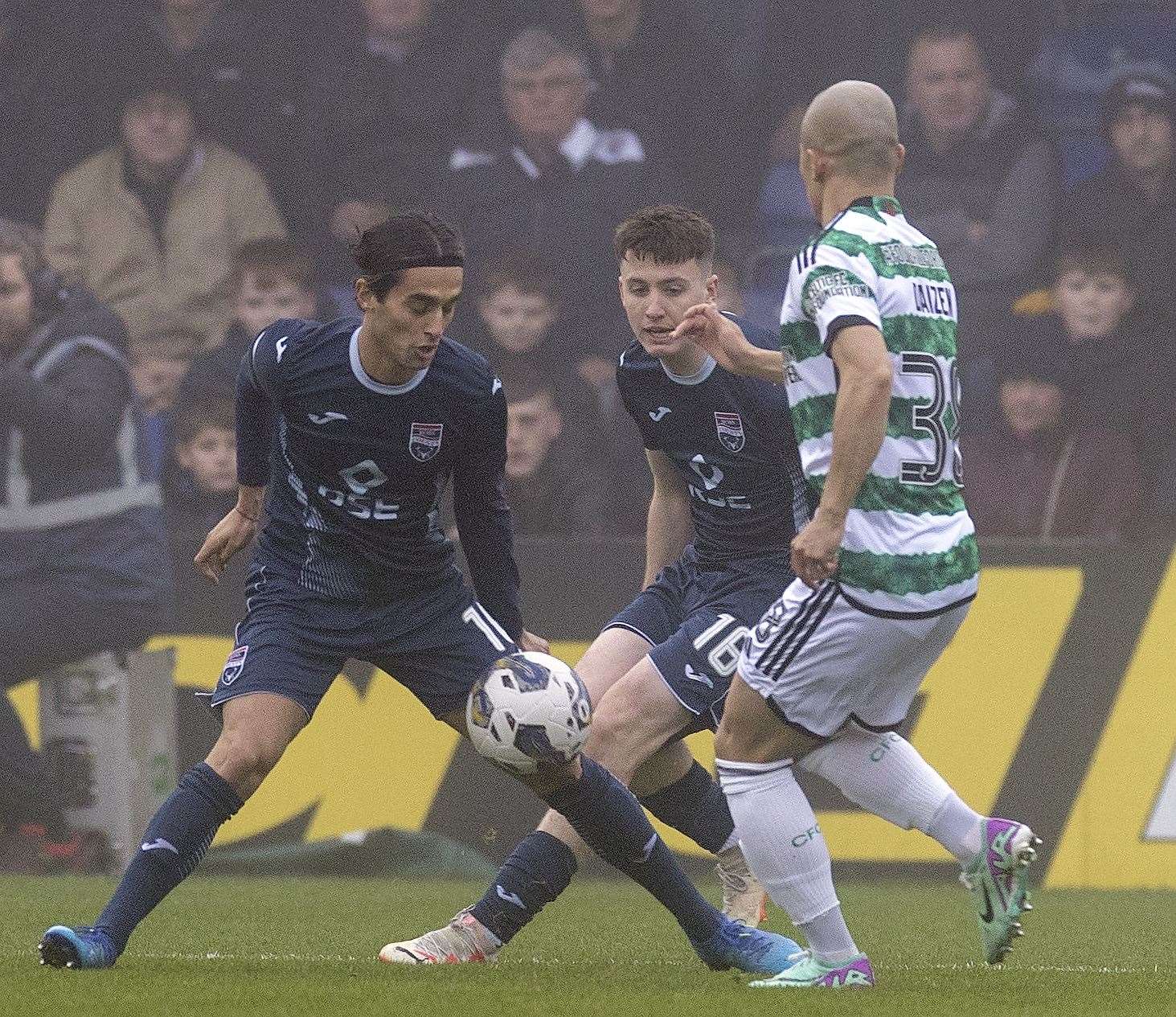 Ross County's Yan Dhanda and George Harmon Bloch the way forward from Celtic’s Daizen Maeda in early November. Picture: Ken Macpherson