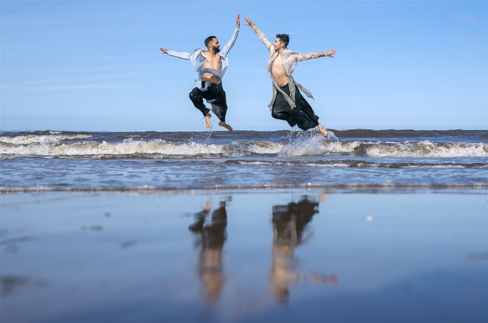 These dancers used the sea in a performance on Portobello Beach near Edinburgh to promote their Edinburgh Festival show (Jane Barlow/PA)