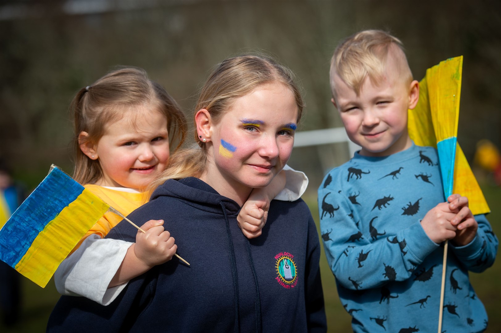 Lola Coburn, Sara Fojut and Oskar Fojut were amongst those walking for Ukraine at Munlochy Primary School. Picture: Callum Mackay.