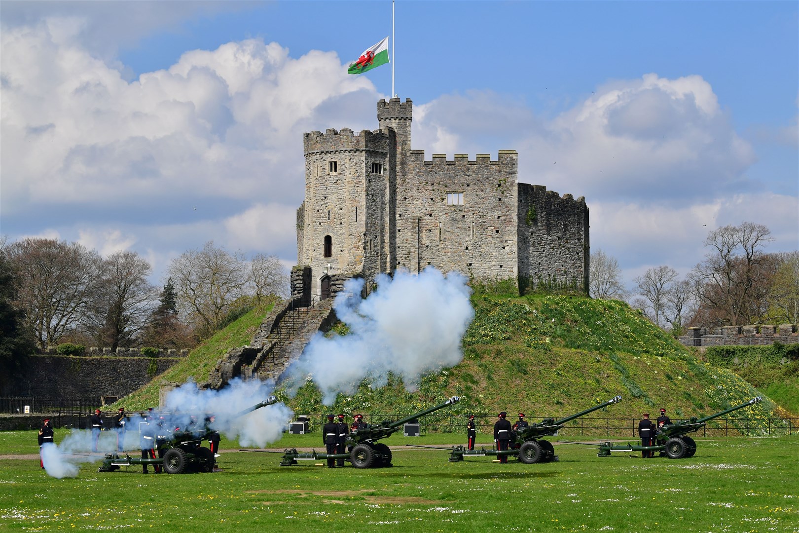 Members of the 104th Regiment Royal Artillery fire a 41-round gun salute in the grounds of Cardiff Castle (Ben Birchall/PA)